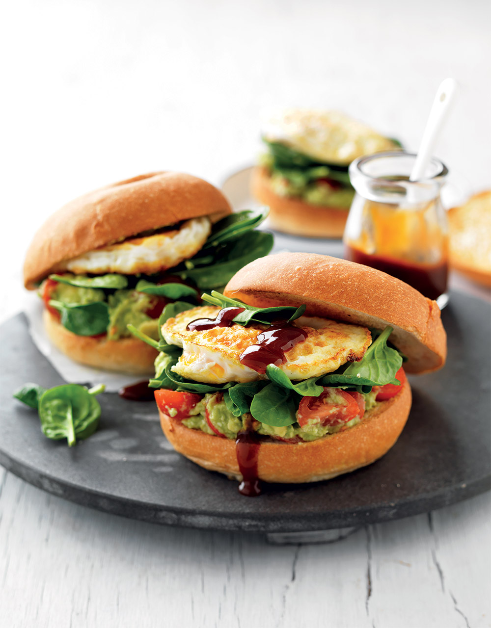 Avocado, tomato & feta smash & egg burgers