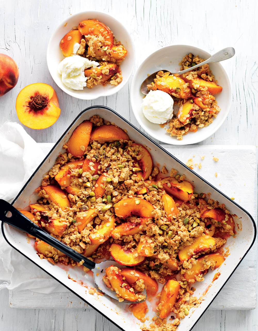 Roasted peaches with pistachio crumble