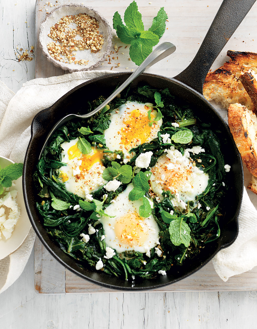 Sauteed greens with eggs, mint & feta